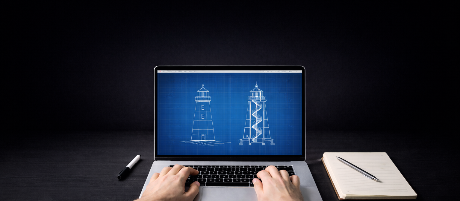 Person using a laptop with a lighthouse blueprint on the screen, on a dark background